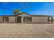 Charming single-story home with a desert landscape, neutral siding, and dark window shutters at 9735 W Altadena Dr, Casa Grande, AZ 85194