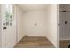 Bright laundry room with a door, laundry hookups, and new flooring at 9735 W Altadena Dr, Casa Grande, AZ 85194