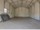 Interior of a bright and airy workshop with concrete floors and metal walls at 9735 W Altadena Dr, Casa Grande, AZ 85194