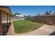 Backyard with well-maintained lawn, block fence, and a storage shed visible at 9825 N 44Th Ave, Glendale, AZ 85302