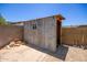 Exterior shot of the backyard shed in a desert landscaped yard with block wall fencing at 9825 N 44Th Ave, Glendale, AZ 85302