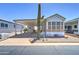 Charming single-story home with carport and mature saguaro cactus in the front yard at 111 S Greenfield Rd # 405, Mesa, AZ 85206