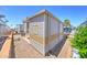 Manufactured home featuring low maintenance desert landscaping and a tranquil outdoor space, nestled in a friendly community at 111 S Greenfield Rd # 405, Mesa, AZ 85206