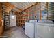 Utility room with washer and dryer and access to storage shelves at 111 S Greenfield Rd # 405, Mesa, AZ 85206