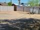 Backyard featuring a large gravel area enclosed by a block wall, and a storage shed at 1116 E Almeria Rd, Phoenix, AZ 85006