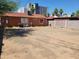 Large backyard with cinderblock fence surrounding the area at 1116 E Almeria Rd, Phoenix, AZ 85006