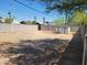 Backyard featuring a large gravel area enclosed by a block wall, and a storage shed at 1116 E Almeria Rd, Phoenix, AZ 85006
