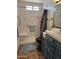 Bathroom featuring black toilet, shower with marble-look surround, and blue vanity at 1116 E Almeria Rd, Phoenix, AZ 85006