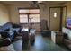 Vintage living room featuring green tile flooring, a ceiling fan, and a variety of seating options at 1116 E Almeria Rd, Phoenix, AZ 85006