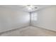 Clean bedroom featuring neutral carpet, walls, a ceiling fan and shuttered windows at 11217 E Laurel Ln, Scottsdale, AZ 85259