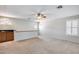 Spacious bonus room with carpet, a wet bar and a shuttered window at 11217 E Laurel Ln, Scottsdale, AZ 85259