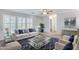 Bright living room with sophisticated decor, plantation shutters, and comfortable seating, perfect for entertaining at 11217 E Laurel Ln, Scottsdale, AZ 85259