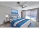 Serene main bedroom with a luxurious bed, stylish decor, and a private patio overlooking the pool at 11217 E Laurel Ln, Scottsdale, AZ 85259