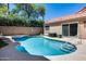 Inviting backyard pool with tiled edges, sun deck, and lush landscaping, perfect for relaxation and entertaining at 11217 E Laurel Ln, Scottsdale, AZ 85259