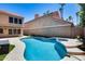 Sparkling private pool surrounded by lush landscaping and a spacious patio, perfect for outdoor entertaining at 11217 E Laurel Ln, Scottsdale, AZ 85259