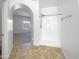 Bright bathroom featuring a walk-in shower and tile floors at 11534 E Downing St, Mesa, AZ 85207