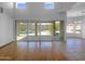 Bright living room with soaring ceilings and an expanse of windows looking out onto the backyard pool at 11534 E Downing St, Mesa, AZ 85207