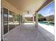 Covered patio perfect for entertaining with views of the lush backyard at 11534 E Downing St, Mesa, AZ 85207