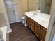 Bathroom with double sinks, shower, tub, and updated flooring at 1212 W Glenmere Dr, Chandler, AZ 85224