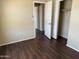 Bedroom with new flooring, closet, and natural light at 1212 W Glenmere Dr, Chandler, AZ 85224