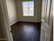 Bedroom featuring wood-look floors and ample natural light at 1212 W Glenmere Dr, Chandler, AZ 85224