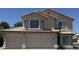 Inviting two-story home featuring a three-car garage and well-maintained landscaping at 1212 W Glenmere Dr, Chandler, AZ 85224