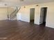 Open-concept living room featuring new, modern flooring and an abundance of natural light at 1212 W Glenmere Dr, Chandler, AZ 85224