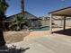 Backyard pool featuring a patio and desert landscaping, creating a serene outdoor living space at 1212 W Glenmere Dr, Chandler, AZ 85224