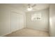 Bedroom with neutral carpet, double closet doors, and window with light at 13034 N 8Th Ave, Phoenix, AZ 85029