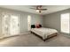 Cozy bedroom with a ceiling fan and large windows providing natural light at 13034 N 8Th Ave, Phoenix, AZ 85029