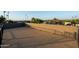 A wide, flat roof with a light brown surface. Shadowing from above. A rail is visible in the corner at 13034 N 8Th Ave, Phoenix, AZ 85029