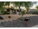 Charming home with xeriscape landscaping, featuring cacti and mature desert trees at 13034 N 8Th Ave, Phoenix, AZ 85029