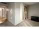 Hallway with custom lighting, textured wood panels, and neutral colored walls at 13034 N 8Th Ave, Phoenix, AZ 85029