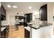 Spacious kitchen with stainless steel appliances, ample counter space, and modern cabinetry at 13034 N 8Th Ave, Phoenix, AZ 85029