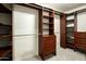 Spacious walk-in closet with custom shelving and drawers for optimal storage at 13034 N 8Th Ave, Phoenix, AZ 85029