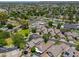 Expansive aerial shot of a Gathering-friendly suburban neighborhood with community pool, green landscaping and mountain views at 1417 E Marshall Ave, Phoenix, AZ 85014