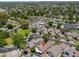 Expansive aerial shot of a Gathering-friendly suburban neighborhood with community pool, green landscaping and mountain views at 1417 E Marshall Ave, Phoenix, AZ 85014