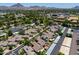 An aerial view of a peaceful residential neighborhood surrounded by lush trees and a mountain backdrop at 1417 E Marshall Ave, Phoenix, AZ 85014