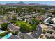 Scenic aerial view of a gated community with lush greenery and mountain views at 1417 E Marshall Ave, Phoenix, AZ 85014