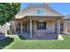 Backyard view showcasing the home's exterior, covered patio, and artificial grass at 1417 E Marshall Ave, Phoenix, AZ 85014
