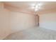 Light and airy carpeted bedroom with ceiling fan and wall lighting at 1417 E Marshall Ave, Phoenix, AZ 85014