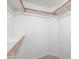 A large walk-in closet featuring custom shelving and rod system for optimized organization and storage at 1417 E Marshall Ave, Phoenix, AZ 85014