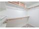 Walk-in closet with multiple shelves and rods for ample storage and organization at 1417 E Marshall Ave, Phoenix, AZ 85014