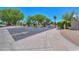 Community gate with lush landscaping and a well-maintained entrance perfect for privacy at 1417 E Marshall Ave, Phoenix, AZ 85014