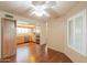The dining room flows into the kitchen, and features wood floors and plantation shutters at 1417 E Marshall Ave, Phoenix, AZ 85014