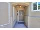 Covered front porch with a secure screen door, welcome mat, and decorative accents at 1417 E Marshall Ave, Phoenix, AZ 85014