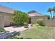 Home's front entrance with well manicured bushes that is welcoming with lots of privacy at 1417 E Marshall Ave, Phoenix, AZ 85014