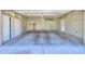 Spacious garage featuring ample storage cabinets and a clean, epoxy-coated floor at 1417 E Marshall Ave, Phoenix, AZ 85014