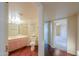 Hallway featuring wood floors leading to bathroom and bedroom at 1417 E Marshall Ave, Phoenix, AZ 85014