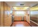 Updated kitchen features stainless steel appliances, wood floors, and bright lighting at 1417 E Marshall Ave, Phoenix, AZ 85014